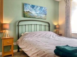 Voodi või voodid majutusasutuse Kerrim Cottage toas