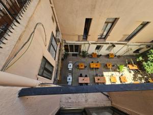 an overhead view of a building with chairs and tables at Hotel Palermo in Barcelona