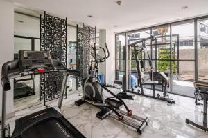 a fitness room with a gym with tread machines at Moda Condo Nimman 608 - Super Deluxe Mountain View next to MAYA in Chiang Mai