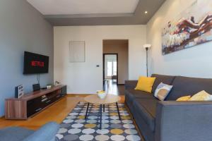 a living room with a couch and a table at Belgrade Central QUINCE Apartment in Belgrade
