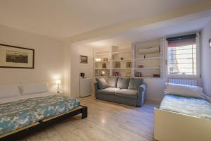 a living room with a bed and a couch at Cristina Rossi Bed&Breakfast in Bologna