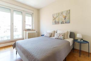 a bedroom with a large bed with two pillows at Belgrade Central QUINCE Apartment in Belgrade