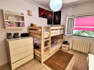 a bedroom with two bunk beds and a desk at Villa Tossalet VYB in El Tosalet +39 photos