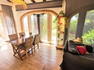a living room with a couch and a table at Villa Tossalet VYB in El Tosalet