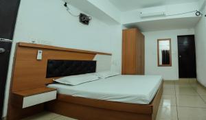 Ένα ή περισσότερα κρεβάτια σε δωμάτιο στο Saras Lodge