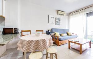 a living room with a table and a couch at Beautiful Apartment In Canet De Berenguer in Canet de Berenguer