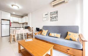 a living room with a couch and a table at Beautiful Apartment In Canet De Berenguer in Canet de Berenguer
