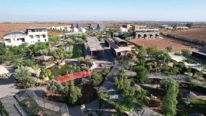 an aerial view of a park with trees and buildings at The Ranch Resort in Marrakech