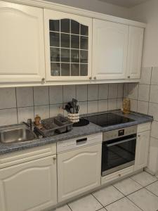 Dapur atau dapur kecil di Monteurhaus Westertweute mit Wintergarten