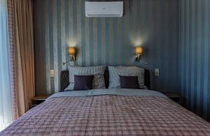 Posteľ alebo postele v izbe v ubytovaní Profi Kecó Apartman