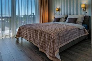 Posteľ alebo postele v izbe v ubytovaní Profi Kecó Apartman
