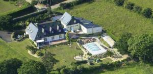 an aerial view of a large house with a swimming pool at Meeresbrise in Loperhet