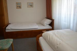 מיטה או מיטות בחדר ב-Hostel am Garten