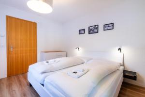 Postel nebo postele na pokoji v ubytování Chalet Wassermandli