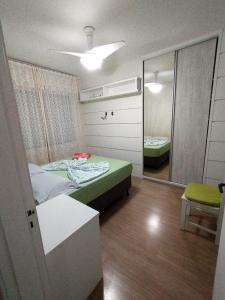 En eller flere senge i et værelse på Aconchego