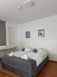 Postel nebo postele na pokoji v ubytování Orange Business Centar Apartments