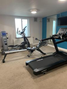 a gym with two exercise bikes and a treadmill at Park Inn by Radisson Shannon Airport in Shannon