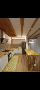 a kitchen with a counter top in a room at Rural apartment La Cantonada in Guardiola de Berguedà