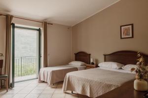 Posteľ alebo postele v izbe v ubytovaní Agriturismo Cupiglione