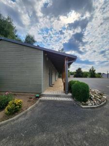 a building with a garage with at Domaine de Sangayrac in Saint-Amans-des-Cots