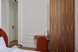 Ένα ή περισσότερα κρεβάτια σε δωμάτιο στο Athens Icon Collection +57 φωτογραφίες