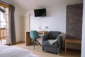 Postel nebo postele na pokoji v ubytování Hotel Aletsch