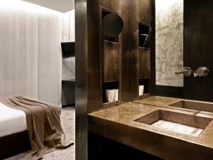 A bed or beds in a room at STRAF, Milan, a Member of Design Hotels
