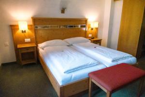Postel nebo postele na pokoji v ubytování Hotel Aletsch