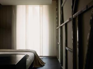 A bed or beds in a room at STRAF, Milan, a Member of Design Hotels