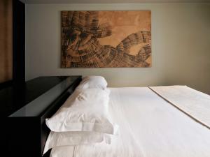 A bed or beds in a room at STRAF, Milan, a Member of Design Hotels