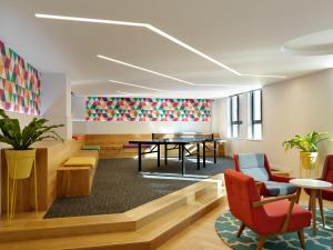 a meeting room with a table and chairs at For Students Only - Modern Rooms in York in York