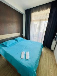 Postel nebo postele na pokoji v ubytování ბინა საბურთალო 2 საძინებელი #8