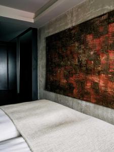 A bed or beds in a room at STRAF, Milan, a Member of Design Hotels