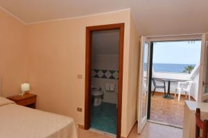 Postel nebo postele na pokoji v ubytování Hotel Costa d'Oro