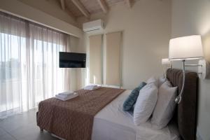 Ένα ή περισσότερα κρεβάτια σε δωμάτιο στο Sanctuary Beach Villas by "Elite"