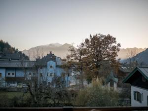 a city with houses and mountains in the background at Apartment Anny 2 by Interhome in Zell am See