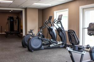 a gym with several exercise bikes in a room at The Tillamook Inn in Tillamook
