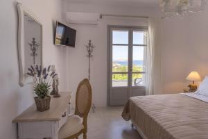 Ένα ή περισσότερα κρεβάτια σε δωμάτιο στο Villas Agia Irini Cove +62 φωτογραφίες