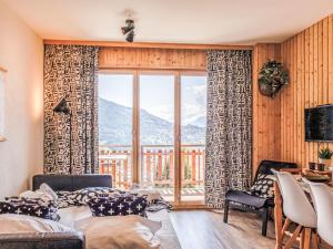 a living room with a view of a mountain at Studio Beau Soleil G11 by Interhome in Veysonnaz