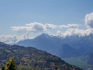 a view of a valley with mountains in the background at Studio Beau Soleil G11 by Interhome in Veysonnaz