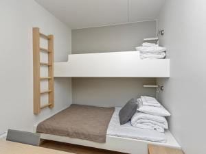 Postel nebo postele na pokoji v ubytování Holiday Home Ruka chalets 3404 by Interhome + 10 fotografií