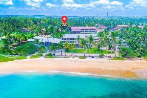 an aerial view of a beach with a red balloon at Rest N surf Apartments in Ahangama
