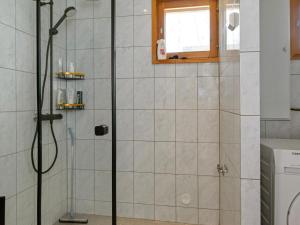 a shower with a glass door in a bathroom at Holiday Home Kesäranta by Interhome in Alavus