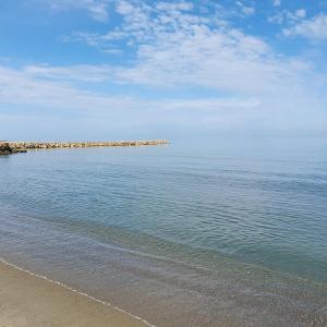 a view of the ocean with a sandy beach at Gurguri Hotel in Golem