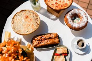 a white table topped with lots of different types of food at Rosen Villa Sibiu in Sibiu +110 photos