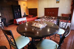 a living room with a table with candles on it at Casa de Huéspedes en Satélite - Boutique Rosas in Mexico City