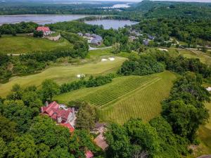 an aerial view of a golf course with a house at Inns at St Albans in Saint Albans