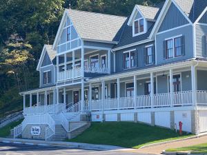 a large blue house with a large front yard at Inns at St Albans in Saint Albans +26 photos