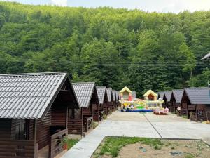 an aerial view of a playground with wooden huts at Casutele Ariesene in Arieşeni