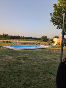 a swimming pool in the middle of a yard at Les morines in Eyrans-de Soudiac